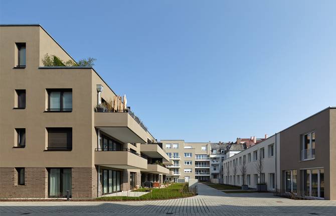 Mehrgenerationenquartier Innenhof Balkone Einfamilienhaus